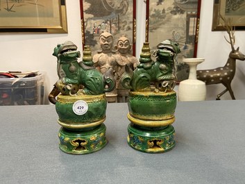 A pair of Chinese sancai-glazed biscuit Buddhist lion joss stick holders, Ming