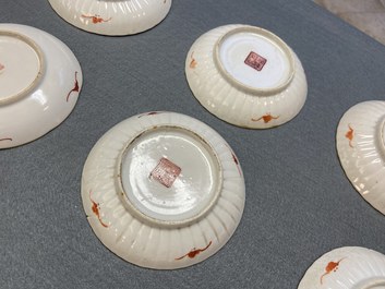 Seven Chinese famille rose saucers, a teapot and a covered box, 19th C.