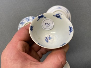 Three Chinese blue and white cups and two saucers, Kangxi