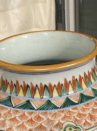 A pair of Chinese blue and white bowls and a famille verte vase, 19th C.