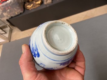 A Chinese blue and white double gourd vase with figures in a landscape, Transitional period