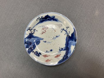 Two Chinese blue, white and copper-red 'fish' plates, Transitional period