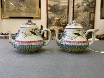 A pair of Chinese famille rose teapots and covers with applied design, Yongzheng