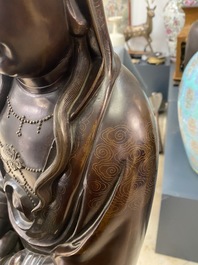 An exceptionally large Chinese silver-inlaid bronze figure of Guanyin, Yutang Shi Sou mark, Qing