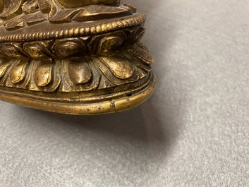 A Chinese gilt bronze 'Medicine Buddha' figure, 17/18th C.