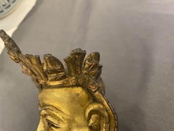 Een Chinese vergulde bronzen figuur van een zittende Boeddha, Ming