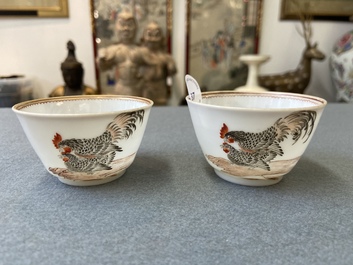 A pair of Chinese grisaille 'hen and rooster' cups and saucers, Yongzheng
