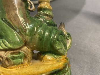 Une paire de porte-encens en forme de lions bouddhistes en biscuit &eacute;maill&eacute; sancai, Ming