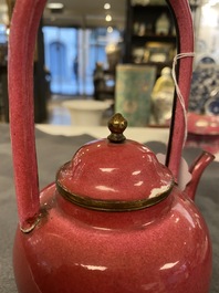 A Chinese ruby-ground Canton enamel teapot and a pair of covered bowls, Qianlong/Jiaqing