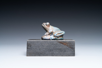 An Egyptian cobalt blue- and turquoise-glazed faience model of a frog, 15/11th C. BC