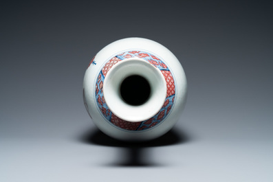 A Chinese blue, white and copper red 'antiquities' bottle vase, Qianlong