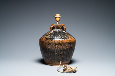 A Chinese brown-spotted black-glazed jar transformed into a lamp, Song