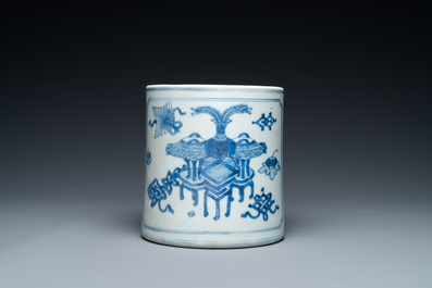 A Chinese blue and white brush pot with a landscape and antiquities, Kangxi