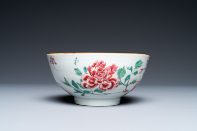 A varied collection of Chinese famille rose and grisaille cups and saucers and a 'rooster' bowl, Yongzheng/Qianlong