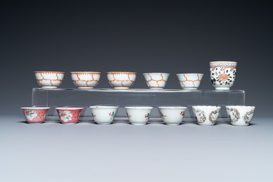 A varied collection of Chinese famille rose and grisaille cups and saucers and a 'rooster' bowl, Yongzheng/Qianlong