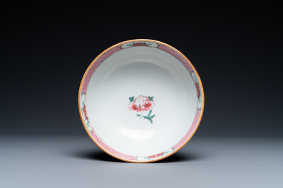 A varied collection of Chinese famille rose and grisaille cups and saucers and a 'rooster' bowl, Yongzheng/Qianlong