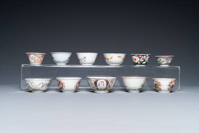 A varied collection of Chinese famille rose and grisaille cups and saucers and a 'rooster' bowl, Yongzheng/Qianlong