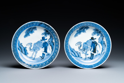 A pair of Japanese blue and white Arita saucer dishes with a Dutchman next to his camel, Edo, 17/18th C.
