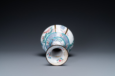 A Chinese Canton enamel bottle vase, Qianlong mark, 19th C.