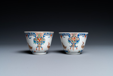 A pair of Chinese famille rose cups and saucers with aquatic birds, Qianlong