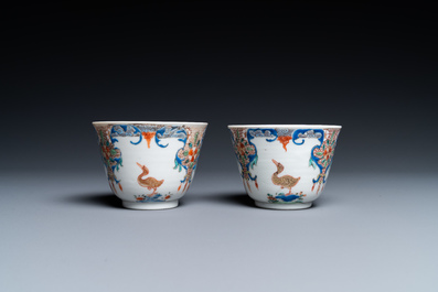 A pair of Chinese famille rose cups and saucers with aquatic birds, Qianlong