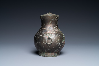 A Chinese bronze 'hu' vase and cover, Han