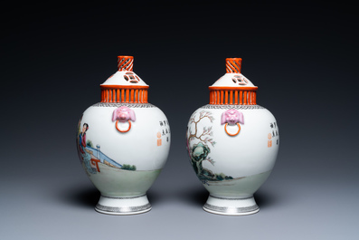 A pair of Chinese famille rose vases with reticulated covers, Qianlong mark, Republic