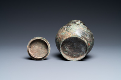 A Chinese bronze 'hu' vase and cover, Han