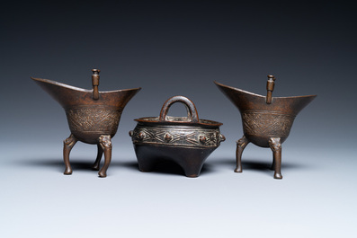 Two Chinese small bronze 'jue' ewers and a tripod censer, probably Yuan