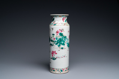 A Chinese famille rose rouleau vase with butterflies and cranes near a lotus pond, 19th C.