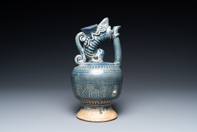 A very rare Vietnamese or Annamese blue-glazed 'shrimp' ewer, 15/16th C.