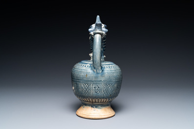 A very rare Vietnamese or Annamese blue-glazed 'shrimp' ewer, 15/16th C.