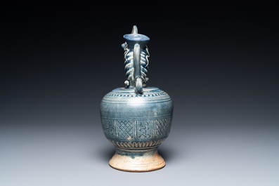 A very rare Vietnamese or Annamese blue-glazed 'shrimp' ewer, 15/16th C.