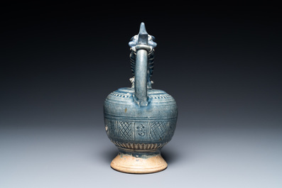 A very rare Vietnamese or Annamese blue-glazed 'shrimp' ewer, 15/16th C.