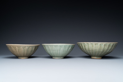 Three Chinese celadon-glazed 'lotus' bowls, Song