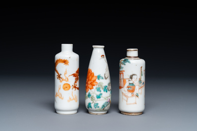 Three Chinese iron red and famille rose snuff bottles incl. one with an erotical subject, 19th C.