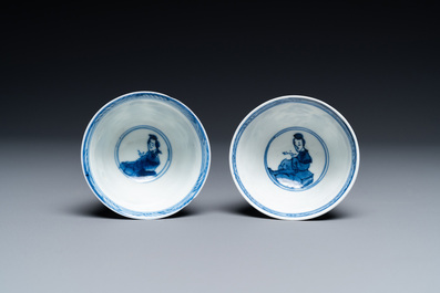 A Chinese blue and white bowl and a pair of cups and saucers, Kangxi