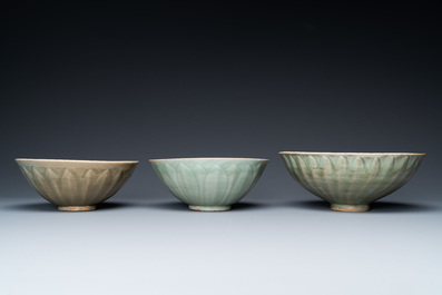 Three Chinese celadon-glazed 'lotus' bowls, Song