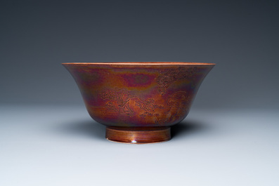 A Chinese aubergine-glazed bowl with incised design of cranes, Kangxi