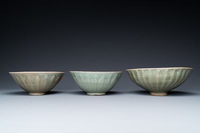 Three Chinese celadon-glazed 'lotus' bowls, Song