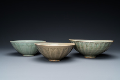 Three Chinese celadon-glazed 'lotus' bowls, Song