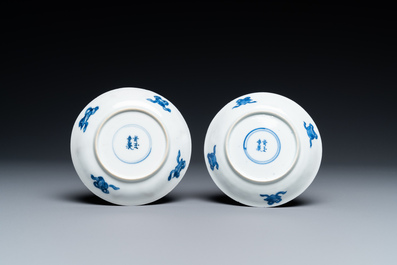 A Chinese blue and white bowl and a pair of cups and saucers, Kangxi