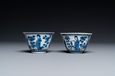 A Chinese blue and white bowl and a pair of cups and saucers, Kangxi