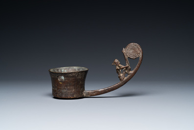 A Vietnamese bronze ladle depicting a musician, Dong Son, ca. 5th/2nd C. BC