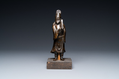 A Chinese partly gilt bronze figure of a scholar, Ming