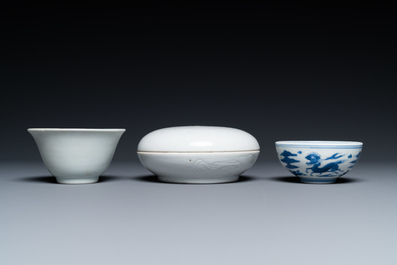 A Chinese white-glazed bowl, a small blue and white bowl and a covered box with incised design, Ming and Qing