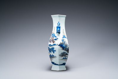 A Chinese blue, white and copper-red 'mountainous landscape' vase, 19th C.