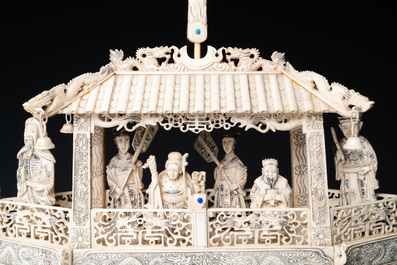 A Chinese carved ivory dragon boat on wooden stand, 19th C.