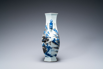 A Chinese blue, white and copper-red 'mountainous landscape' vase, 19th C.