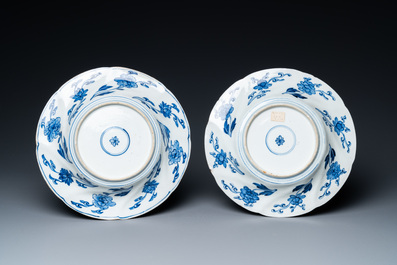 A pair of Chinese blue and white lobed 'phoenix and monkey' plates, Kangxi